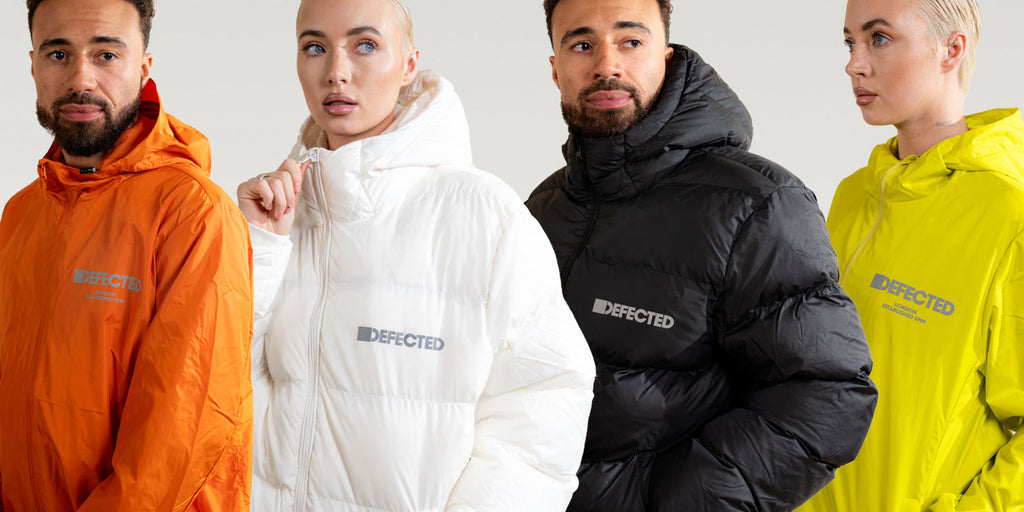 A line of young people wearing Defected puffer jackets and wind breakers 